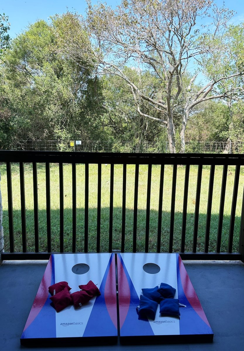 Cornhole game at the back patio
